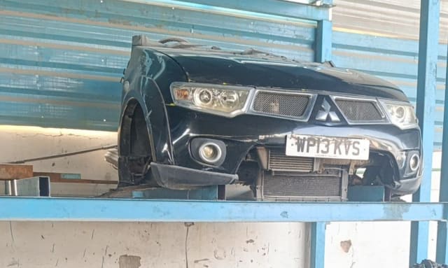 Black Mitsubishi L200 front halfcut — bumper, grille, headlights and radiator, Sharjah market