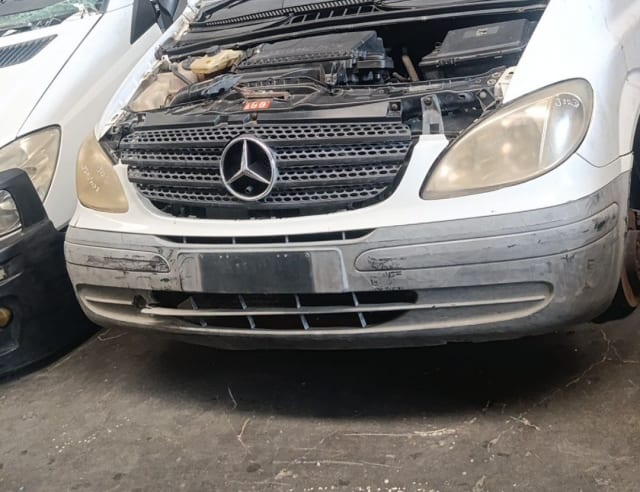 White Mercedes-Benz Vito van halfcut front — grille, headlights, bumper and open engine bay, Sharjah market