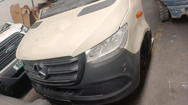 White Mercedes-Benz Sprinter halfcut front — hood, grille, headlight and grey bumper, Sharjah market