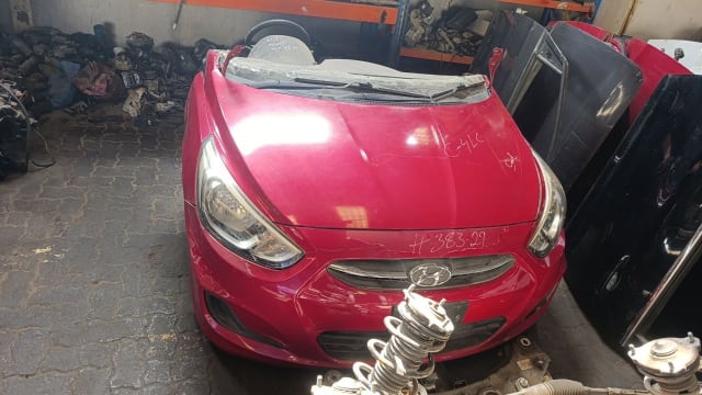 Red Hyundai Accent front halfcut with hood, bumper, grille and headlights, Sharjah market