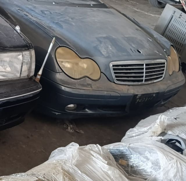 Dark blue-grey Mercedes-Benz C-Class halfcut front — hood, grille, headlights and bumper, Sharjah market