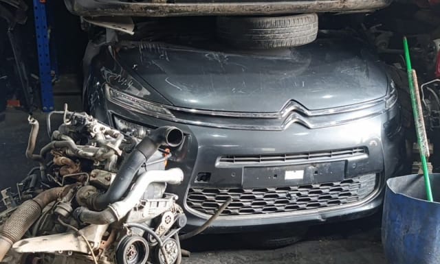 Dark grey Citroen C4 Picasso front halfcut — hood, chrome grille, bumper and DRLs, Sharjah market