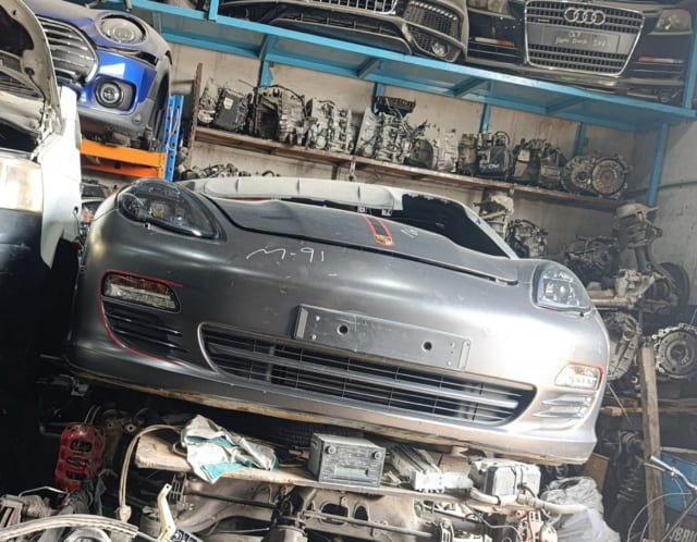 Grey Porsche Panamera front cut with bumper, headlights and hood, Sharjah parts market
