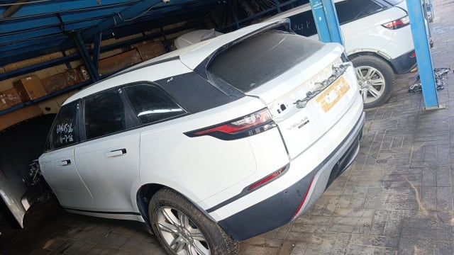 White Range Rover Velar car for parts, rear view with tailgate, tail lights and rear bumper, Sharjah market