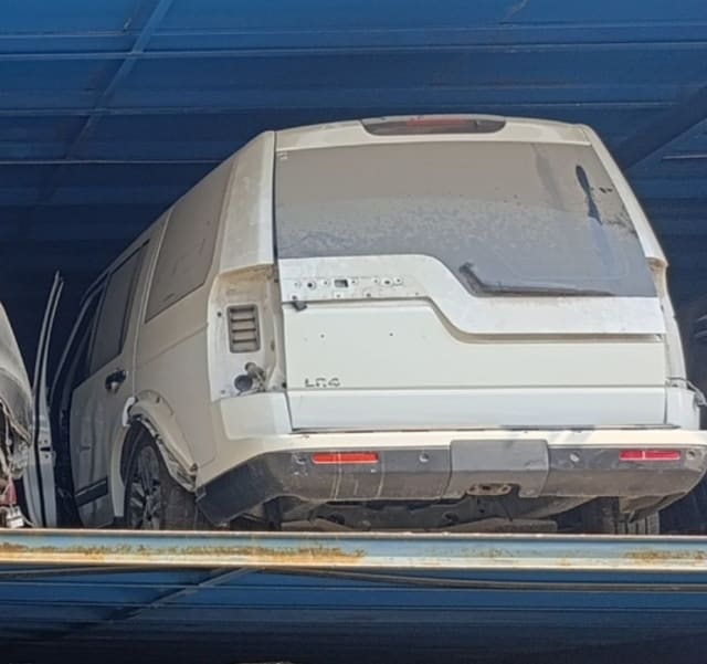 White Land Rover LR4 car for parts, rear view with tailgate, rear bumper and glass, Sharjah market