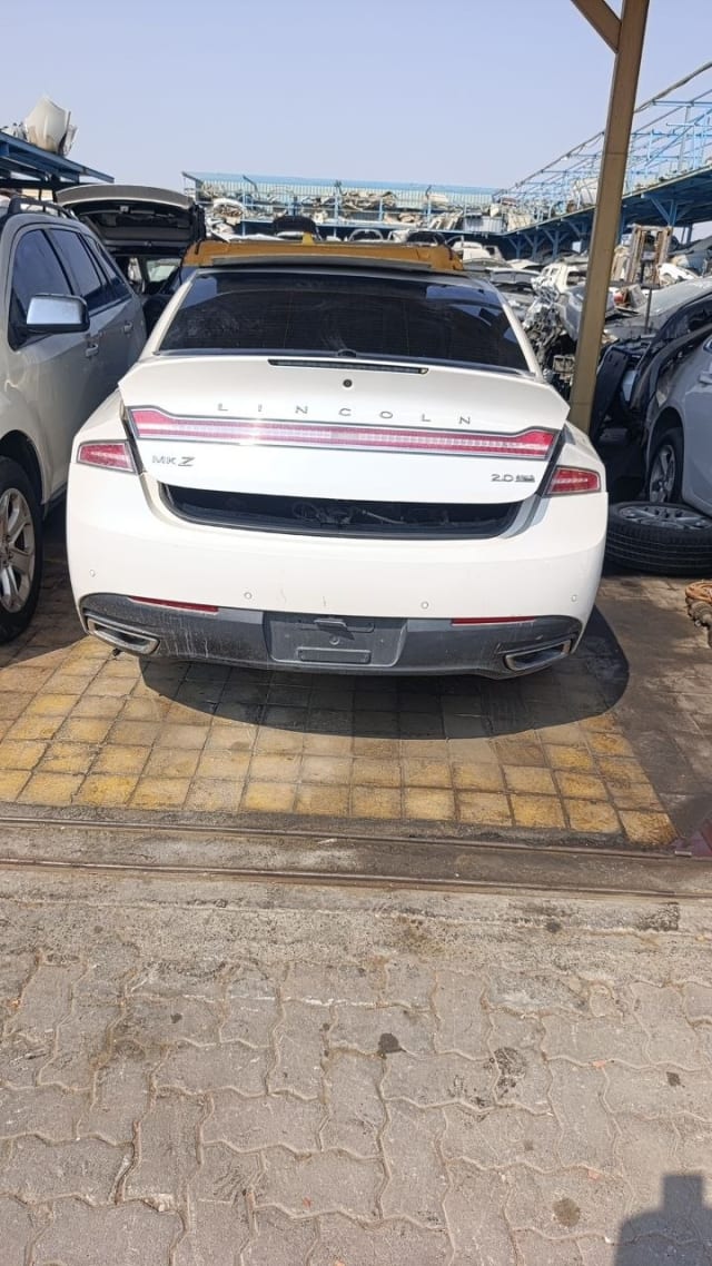 White Lincoln MKZ sedan rear view — trunk lid, LED tail light bar and rear bumper, Sharjah market