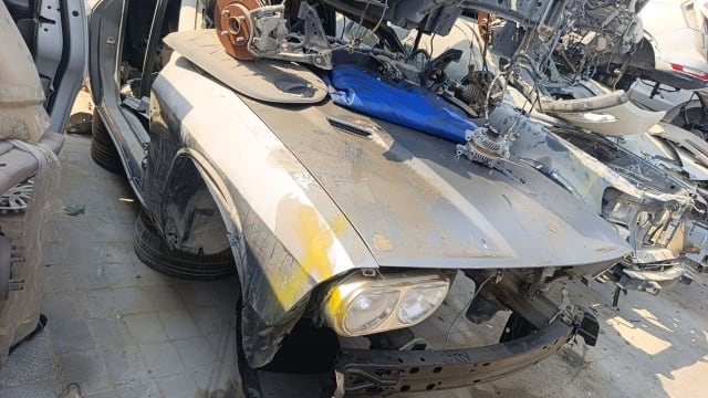 Grey Dodge Challenger halfcut — hood, front fender, headlight and bumper reinforcement, Sharjah market