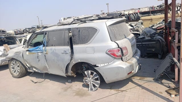 Silver Nissan Patrol SUV halfcut, rear side view with tail lights, doors and alloy wheels, Sharjah market