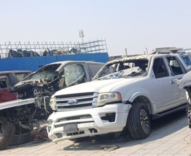 White Ford Expedition car for parts with chrome grille, headlight, hood and damaged roof, Sharjah market
