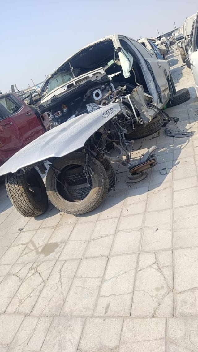 Silver RAM 1500 car for parts — dismantled front end, loose 1500 fender and tyres, Sharjah market
