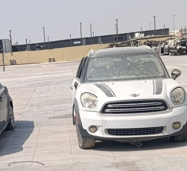 White MINI Countryman car for parts — hood with stripes, headlights, grille and front bumper, Sharjah market