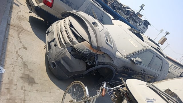 Dark grey Ford Explorer for parts: front bumper, grille, headlights and hood, Sharjah market