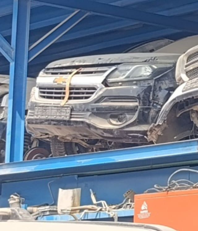 Black Chevrolet TrailBlazer front halfcut on rack — hood, grille, headlight and bumper, Sharjah market