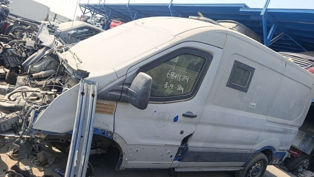 White Ford Transit high-roof van halfcut, side view with driver door, mirror and sliding door, Sharjah market