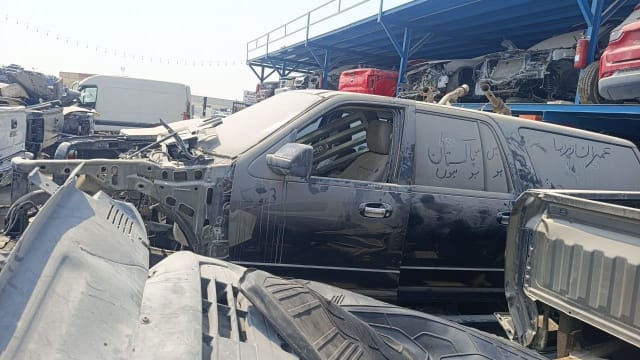 Black Ford Expedition halfcut — doors, mirror and beige interior, stripped front end, Sharjah market