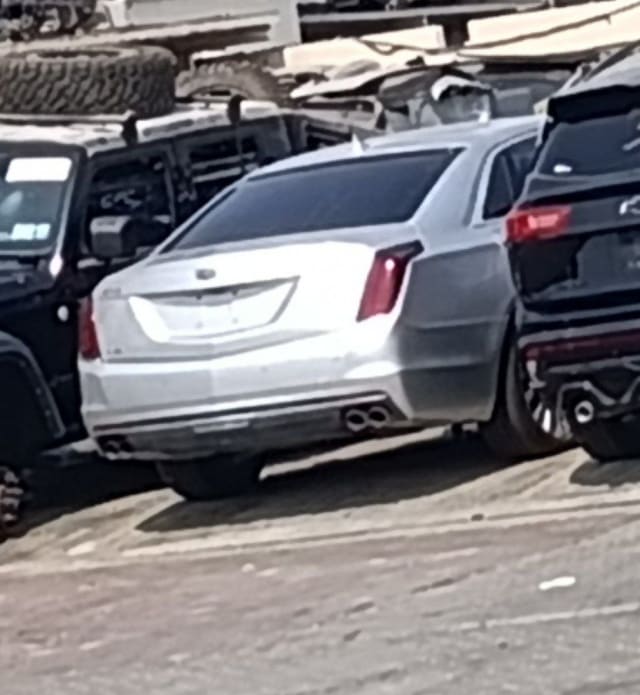 Silver Cadillac CT6 sedan rear view with taillights, trunk lid and rear bumper, Sharjah market