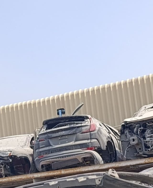 Dark grey Cadillac XT4 car for parts, rear view — tailgate, taillights and rear bumper, Sharjah market