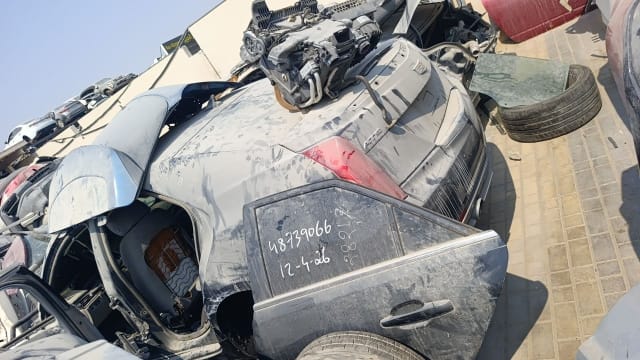 Dusty dark grey Cadillac ATS sedan rear halfcut: trunk, taillight, rear door and quarter panel, Sharjah market