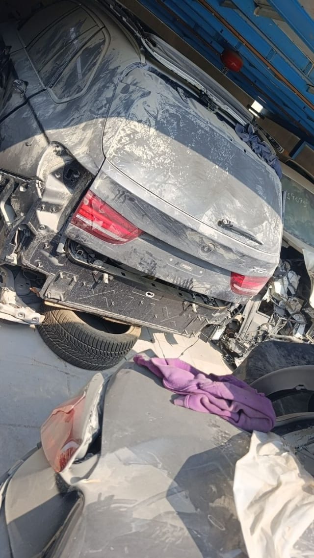 Grey BMW X5 rear halfcut with tailgate, tail lights and exposed bumper mount, Sharjah market