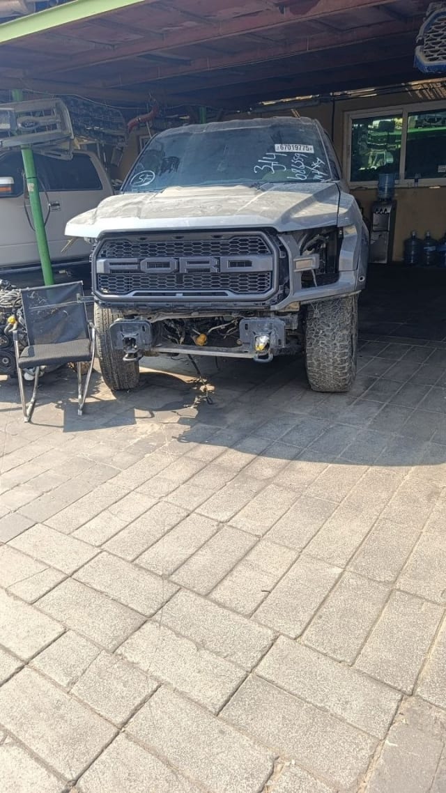 Grey Ford F-150 Raptor for parts — FORD grille, hood, fenders, bumper removed, Sharjah market