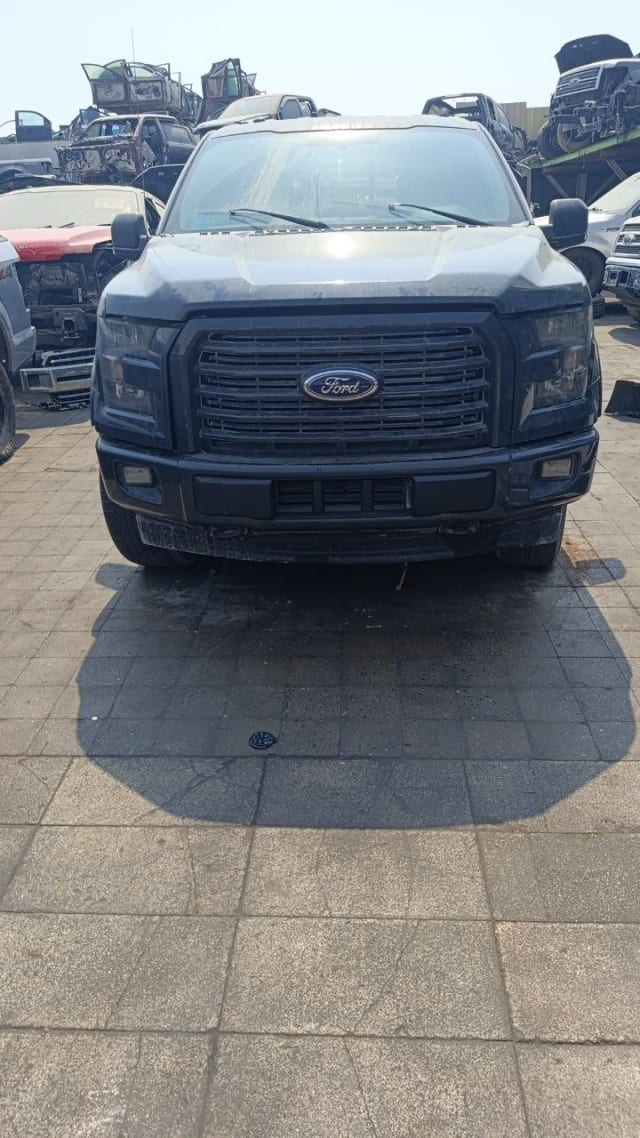 Dark grey Ford F150 pickup front view — hood, grille, headlights and bumper, Sharjah market