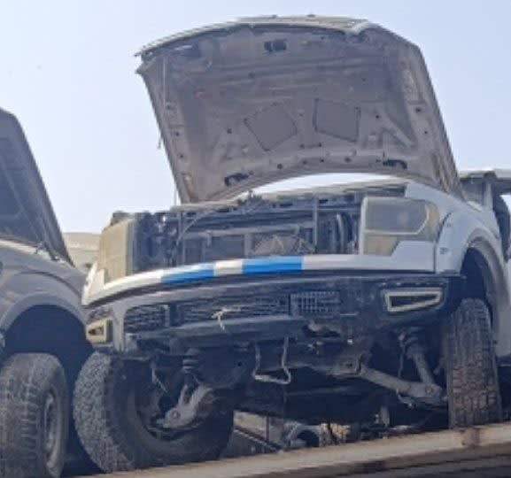 White Ford F-150 SVT Raptor for parts with raised hood, headlights and front bumper, Sharjah market