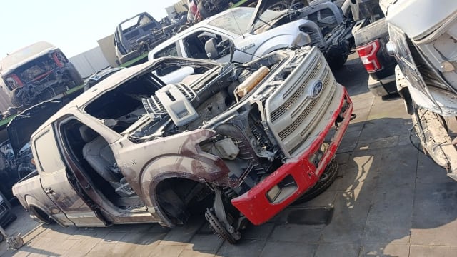 Ford F-150 pickup halfcut with chrome grille, red front bumper, exposed engine bay and cab, Sharjah market