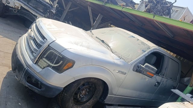 Silver Ford F-150 XLT pickup for parts — grille, headlights, hood and doors, Sharjah market