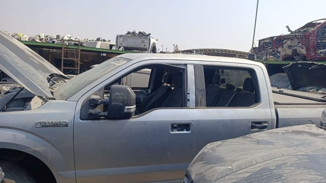 Silver Ford F-150 crew cab car for parts: doors, mirror, fender and open hood, Sharjah market