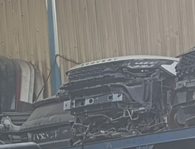White Land Rover Discovery Sport front halfcut — hood, grille and bumper beam, Sharjah market