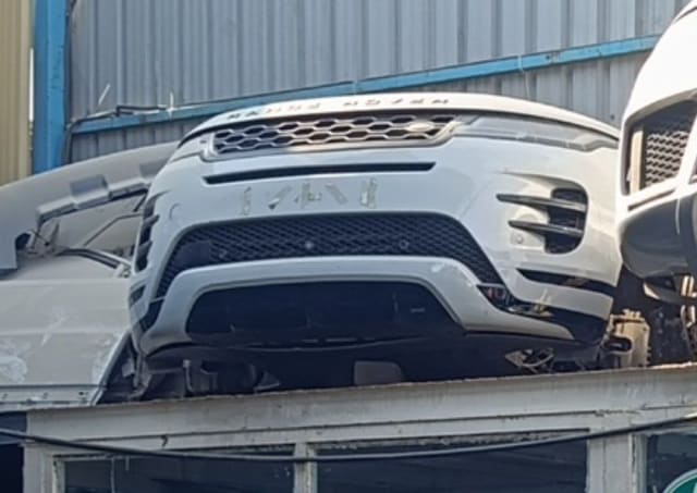 White Range Rover Evoque front halfcut, bumper, grille and hood edge, Sharjah market