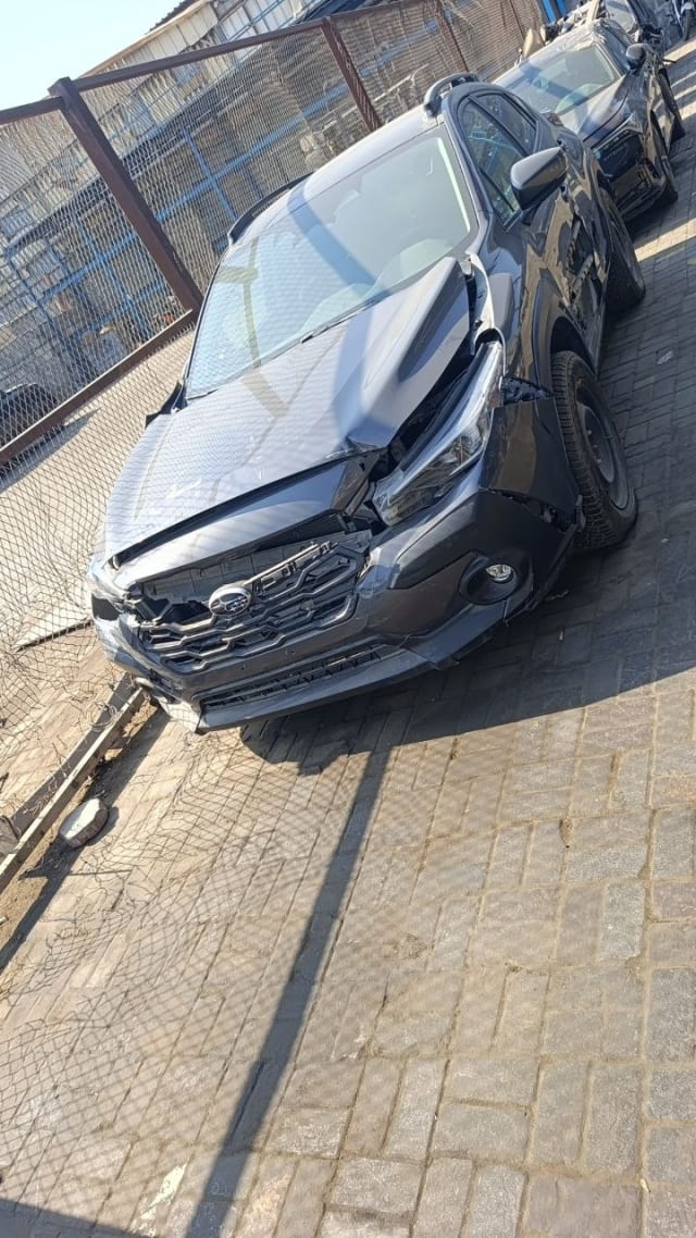 Dark grey Subaru Crosstrek car for parts, damaged hood and front bumper, Sharjah market
