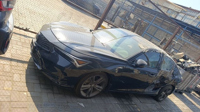 Dark grey Acura Integra liftback for parts — intact front, rear side damage, Sharjah market