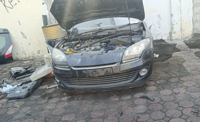 Dark grey Renault Megane front halfcut, hood open, bumper, headlights and engine bay, Sharjah market