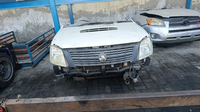 White Holden Rodeo pickup front halfcut — hood scoop, grille, headlights and radiator, Sharjah market