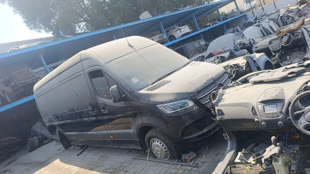 Black Mercedes-Benz Sprinter high-roof van for parts — hood, headlight, grille and doors, Sharjah market