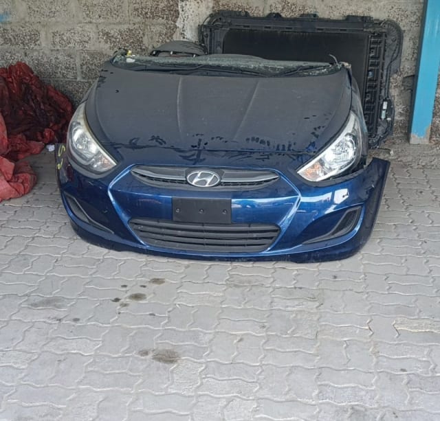 Blue Hyundai Accent front end with hood, headlights, grille and bumper, Sharjah market