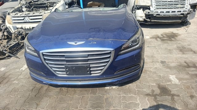 Dark blue Hyundai Genesis sedan front halfcut with hood, chrome grille and headlights, Sharjah market