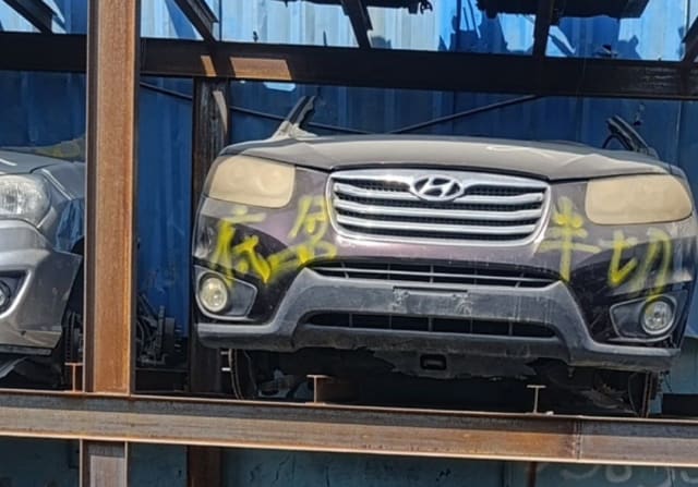 Dark burgundy Hyundai Santa Fe front halfcut with hood, grille, headlights and bumper, Sharjah market