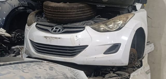 White Hyundai Elantra front halfcut — bumper, grille, headlights and fenders, Sharjah market