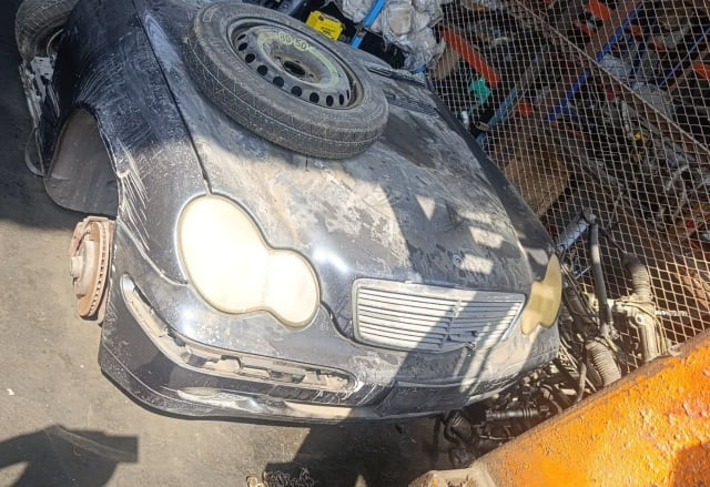 Black Mercedes-Benz C-Class front halfcut with hood, bumper, grille and headlights, Sharjah market