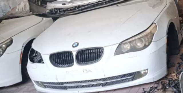White BMW 5-Series front halfcut, hood, kidney grille, bumper and right headlight, Sharjah market