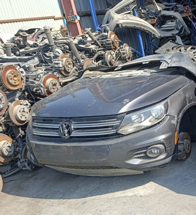 Dark grey Volkswagen Tiguan front halfcut — hood, VW grille, bumper and headlight, Sharjah market