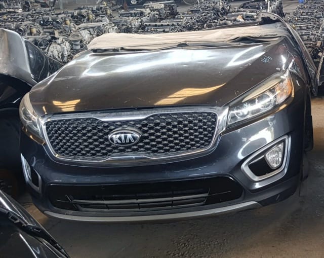 Dark grey Kia Sorento front halfcut — hood, chrome grille, headlights and bumper, Sharjah market