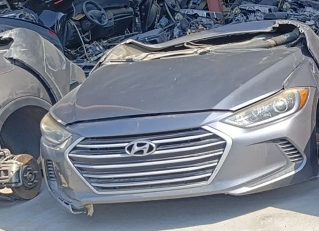 Grey Hyundai Elantra front halfcut — hood, chrome grille, headlights and bumper, Sharjah market