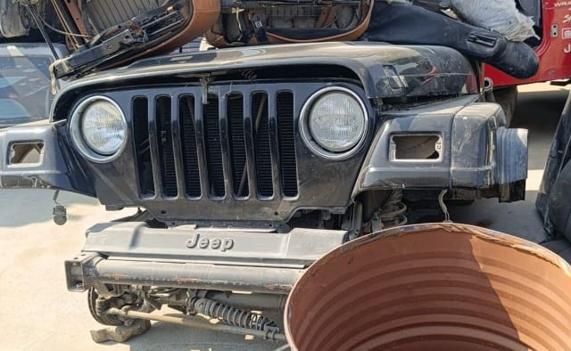 Black Jeep Wrangler front halfcut with seven-slot grille, round headlights, hood and bumper, Sharjah market