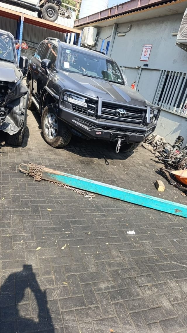 Dark grey Toyota Land Cruiser for parts — ARB bull bar, winch, grille and LED headlights, Sharjah market