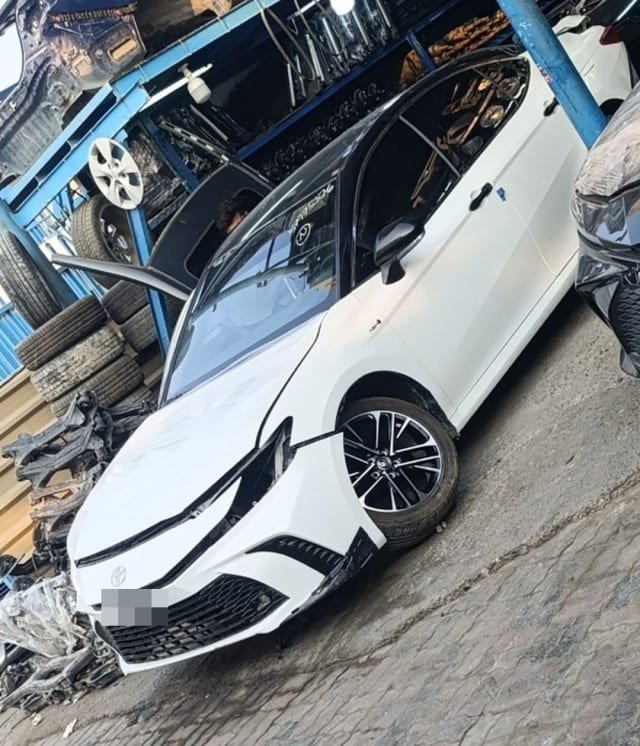 White Toyota Camry sedan for parts with black roof, front bumper, headlights and alloy wheel, Sharjah market
