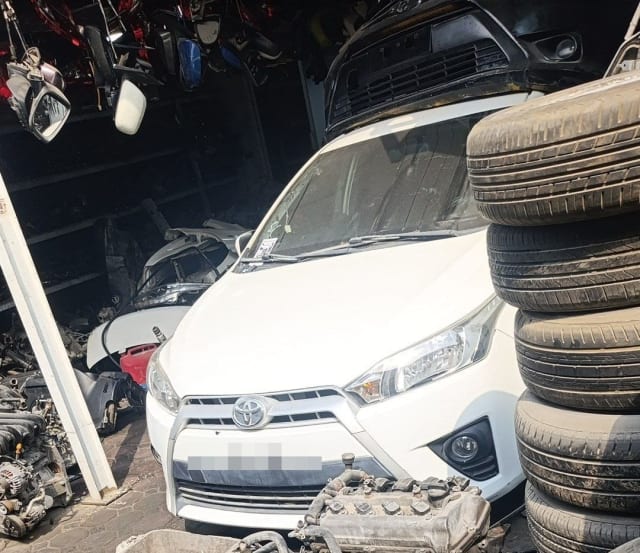 White Toyota Yaris hatchback halfcut: front bumper, grille, headlights and hood, Sharjah market