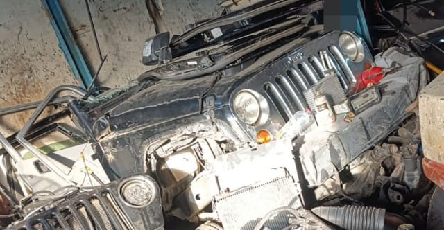 Black Jeep Wrangler halfcut: hood, grille, round headlights, fender and radiator, Sharjah market